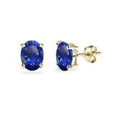 Yellow Gold Flashed Sterling Silver Created Blue Sapphire 7x5mm Oval-Cut Solitaire Stud Earrings - Presidential Brand (R)